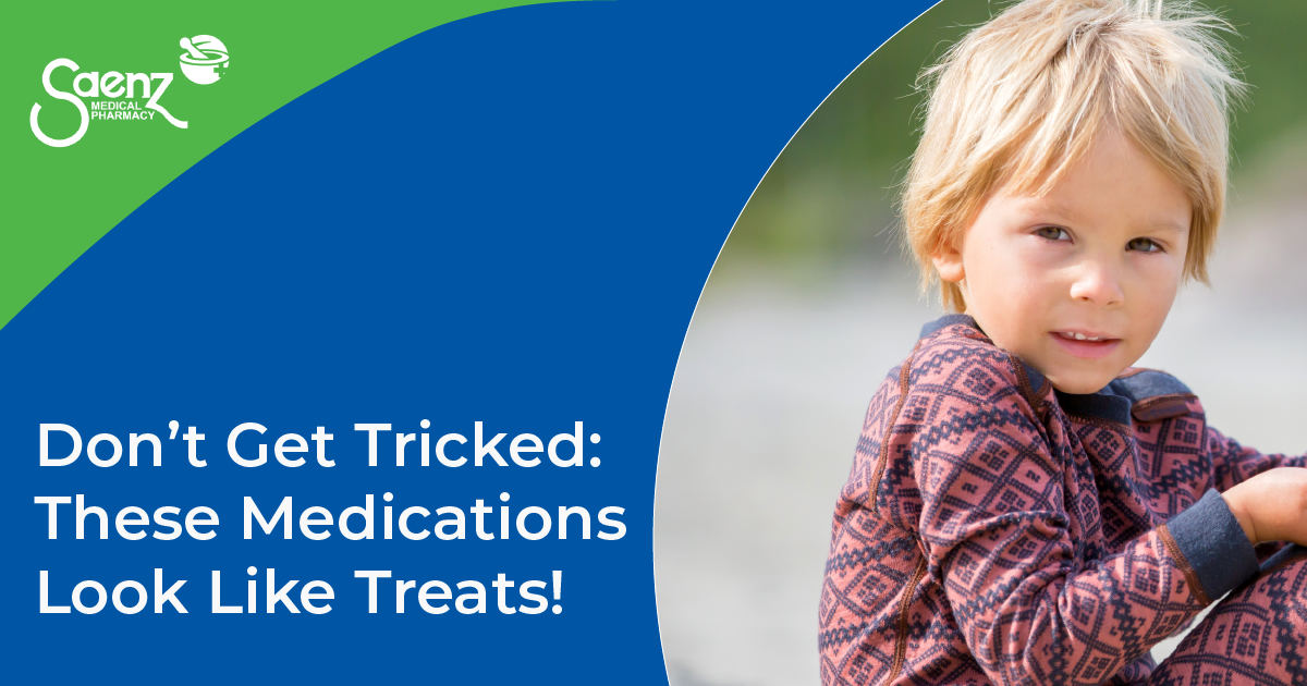 Young child holding a piece of candy.